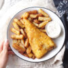 Homemade chip shop style beer battered gluten free fish and chips with dipping sauce